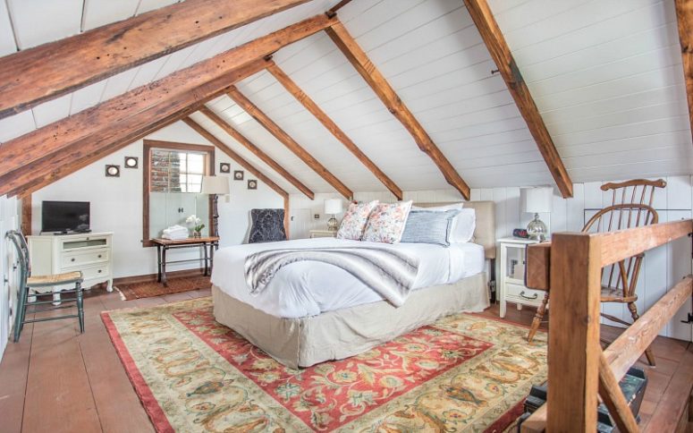 09-the-bedroom-is-done-with-wooden-beams-white-shiplap-printed-rugs-and-elegant-neutral-furniture-775x484-1585497174962354381886.jpg