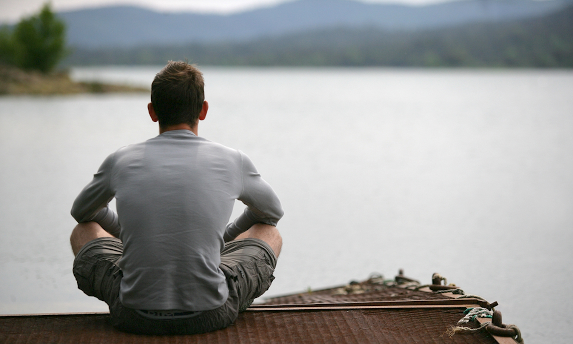 Man looked my life. Мужчина back. Картинка мужчина у воды в горах. Man sitting looking back. Man sitting back.