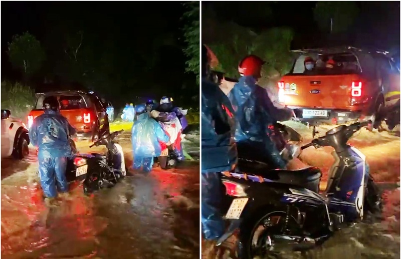 CSGT dầm mưa, lội nước lũ đẩy xe giúp đoàn người về quê qua đèo Lò Xo - Ảnh 2.