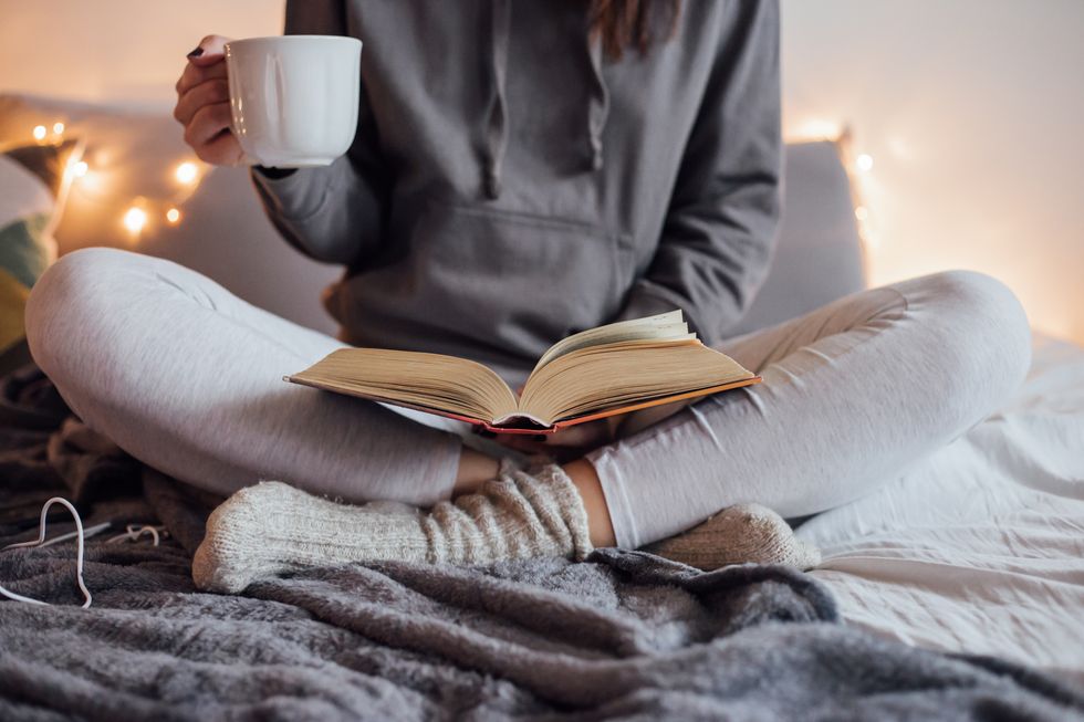 girl-drinking-hot-tea-and-reading-book-in-bed-royalty-free-image-1581394396-1667203004698754330962.jpg