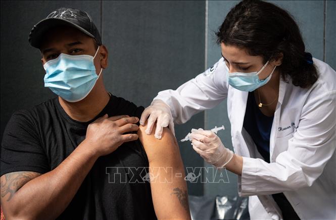 Cảnh báo mới dành cho những người đã tiêm 2 mũi vaccine COVID-19 - Ảnh 1.