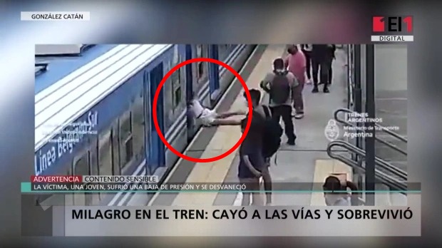 Heart-stopping moment: The girl staggered down onto the tracks just as the train was running, what happened next made all the witnesses 