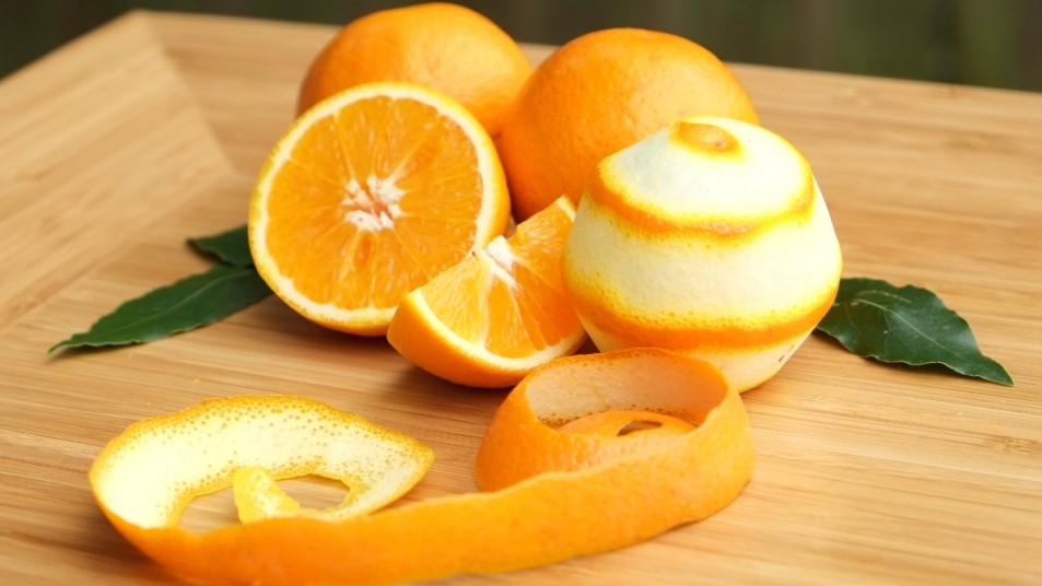 orange-peels-and-oranges-on-a-wooden-cutting-board-gettyimages-661827875-16739484465522090843477-1673956735975-1673956736308341648760.jpg