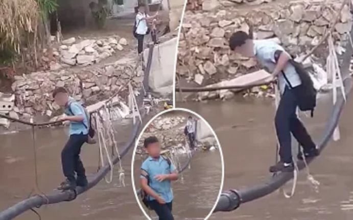 Thót tim cảnh 70 học sinh đi cầu dây vượt sông đầy cá sấu để tới trường