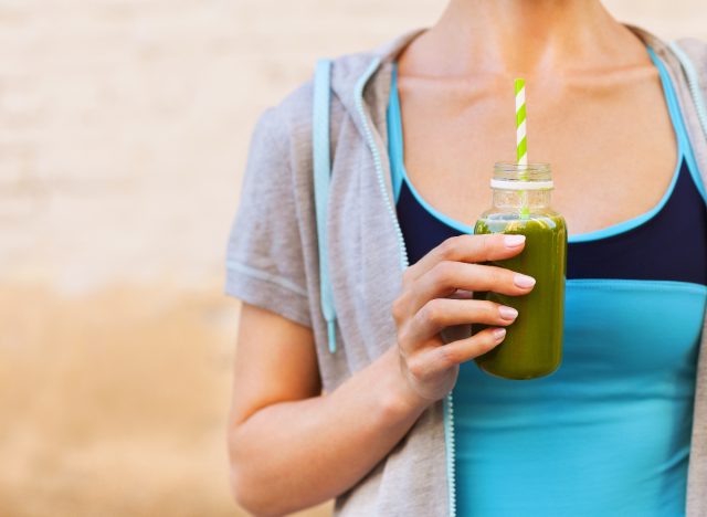 fitness-woman-holding-green-smoothie-1675513182544444733205-1675513385132-1675513385536170475776-1675519728196-16755197285301424320648.jpg