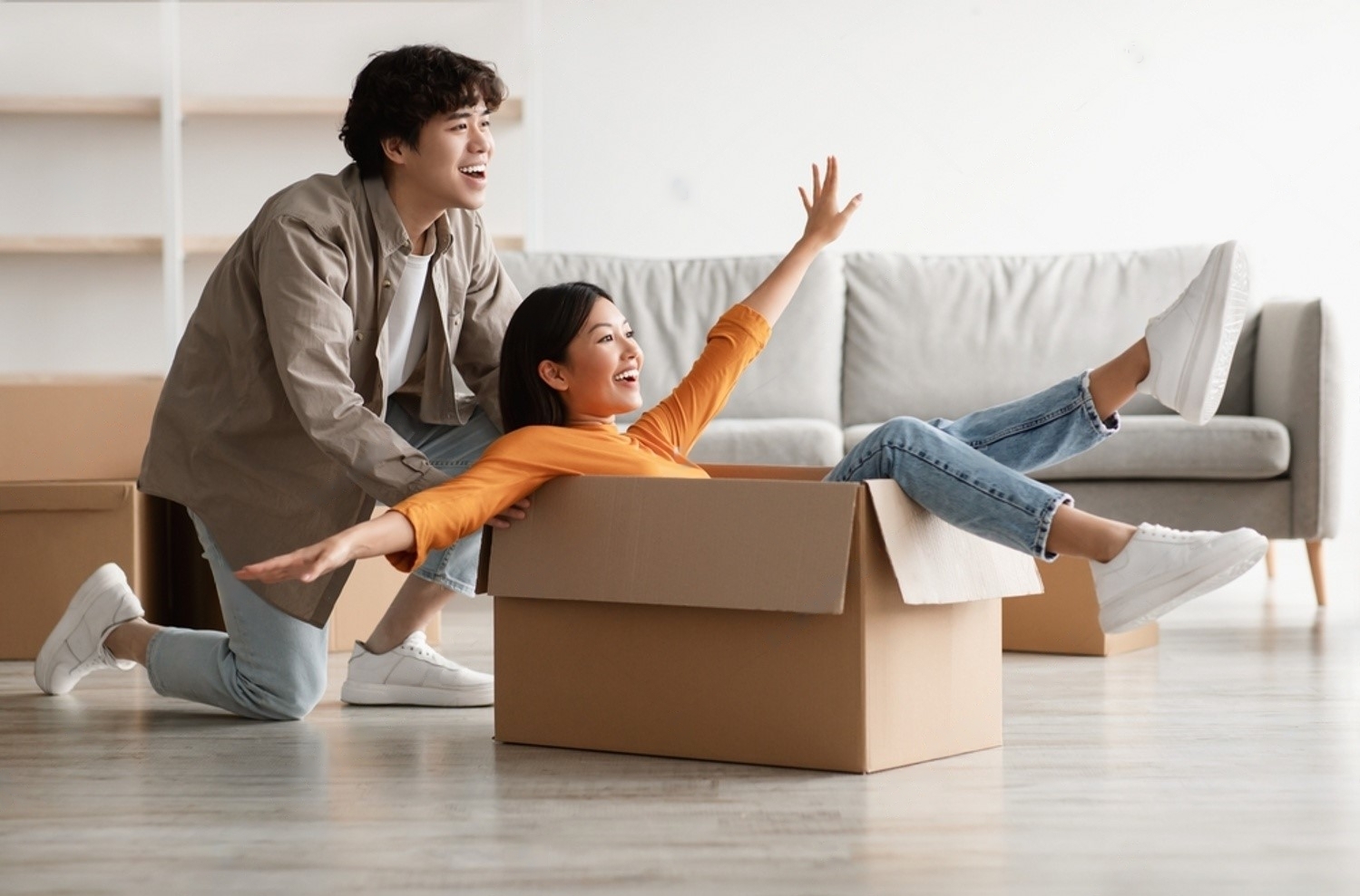-asian-couple-having-fun-in-their-home-on-relocation-day-millennial-woman-and-her-2090125699-transformed-16789646787671797338837-1679052434122-1679052434999108471713.jpeg