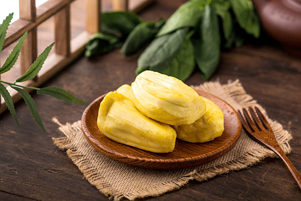 pngtree-gourmet-daytime-jackfruit-is-placed-on-the-wooden-table-photography-map-image_853543.jpeg