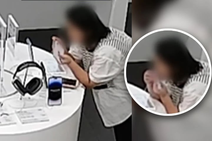 Người phụ nữ dùng răng cắn đứt cáp chống trộm, ăn cắp iPhone 14 - Ảnh 1.