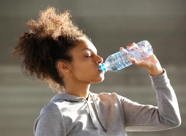 black-woman-drinking-bottled-water-17280435640841478017127.jpg