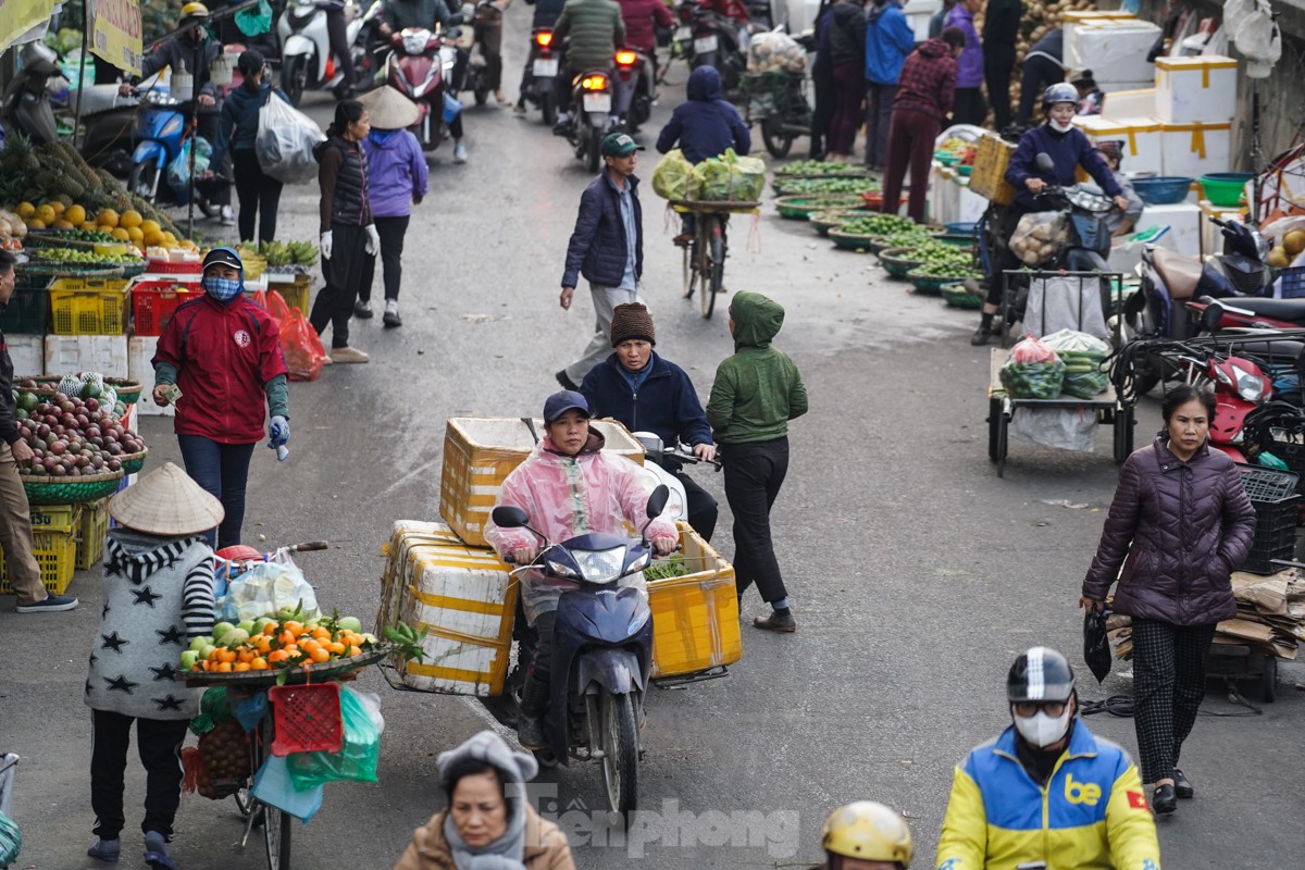 Nhịp sống người dân Thủ đô trong những ngày lạnh 14 độ - Ảnh 7.