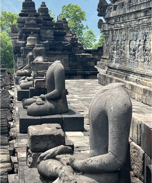 Headless Buddha statues at the temple. Photo: Penny Watson