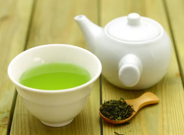 green-tea-cup-teapot-tea-leaves-wooden-spoon-1718362974480687439732.jpg