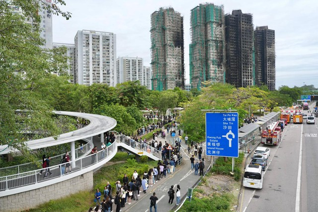 Hình ảnh đau thương tại Hong Kong sau vụ hỏa hoạn lịch sử 128 người thiệt mạng - Ảnh 7.