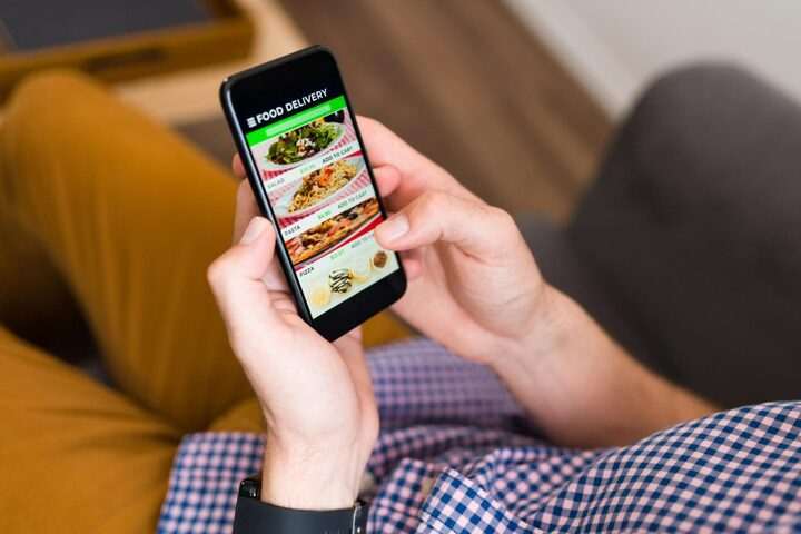 i-m-hungry-hands-man-looking-food-delivery-app-his-smartphone-ordering-dinner-online-1-1280x853-23371702-1746182503945-17461825047061734975512.jpg