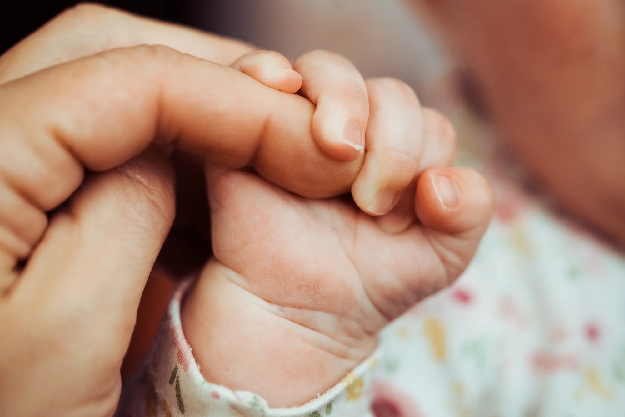 newborn-baby-holding-adult-finger-1751166046129-17511660466311893815191.jpg
