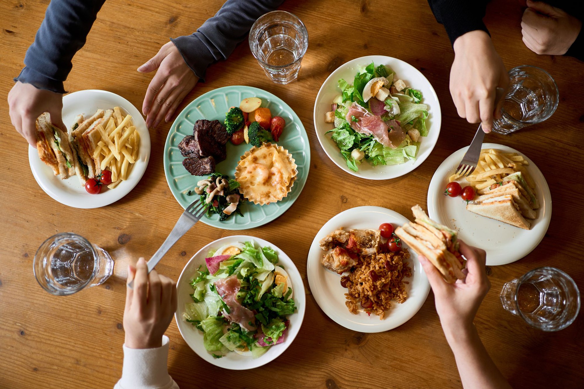 hands-of-women-eating-at-a-girls-association-royalty-free-image-1724358729-1751723588593-17517235937041067392657.jpg