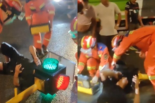 Hy hữu: Người đi xe máy kẹt đầu vào cột đèn giao thông - Ảnh 1. Hy hữu: Người đi xe máy kẹt đầu vào cột đèn giao thông - Ảnh 1.