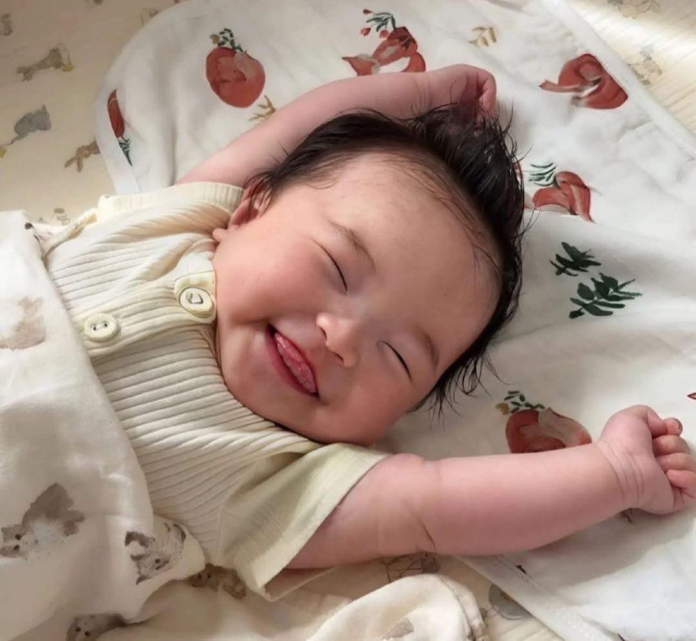 Em b&eacute; hay cười th&igrave; th&ocirc;ng minh hơn?  - Ảnh 1.