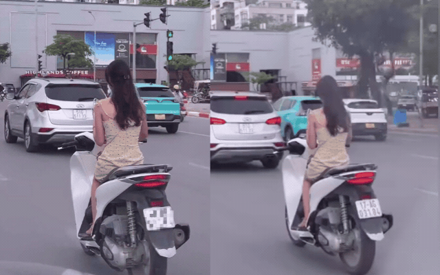 C&ocirc; g&aacute;i SN 2002 vi phạm giao th&ocirc;ng khi sử dụng điện thọai giữa phố H&agrave; Nội - Ảnh 1.