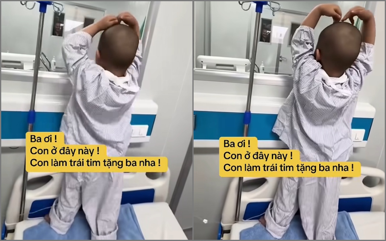 Nhói lòng với clip chiến binh nhí ung thư kiễng chân nhún nhảy gửi trái tim qua ô cửa kính động viên bố: Ba ơi, đừng sợ! - Ảnh 1.