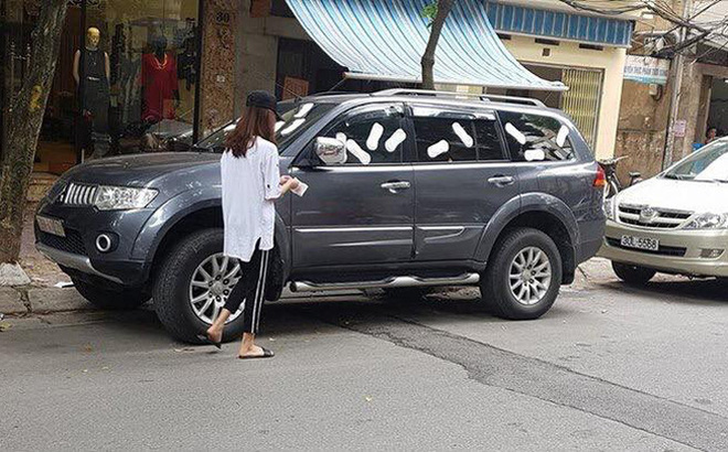Không xử phạt cô gái trẻ dán băng vệ sinh lên xe ô tô đậu trước cửa nhà gây xôn xao dư luận - Ảnh 1. Không xử phạt cô gái trẻ dán băng vệ sinh lên xe ô tô đậu trước cửa nhà gây xôn xao dư luận - Ảnh 1.
