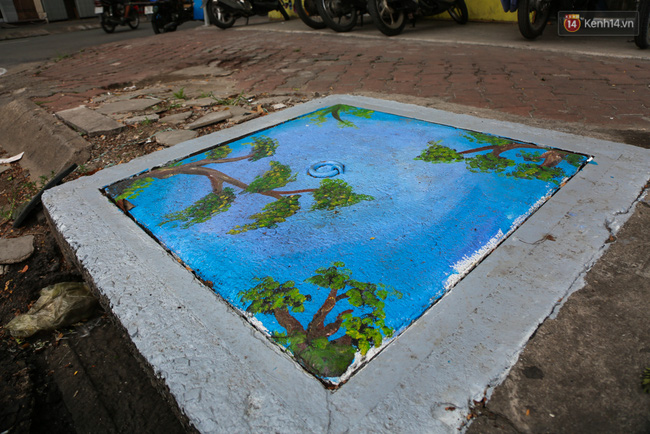 Nhìn những bức tranh trên nắp cống ở Sài Gòn đẹp như thế này, không ai nỡ xả rác nữa! - Ảnh 12.