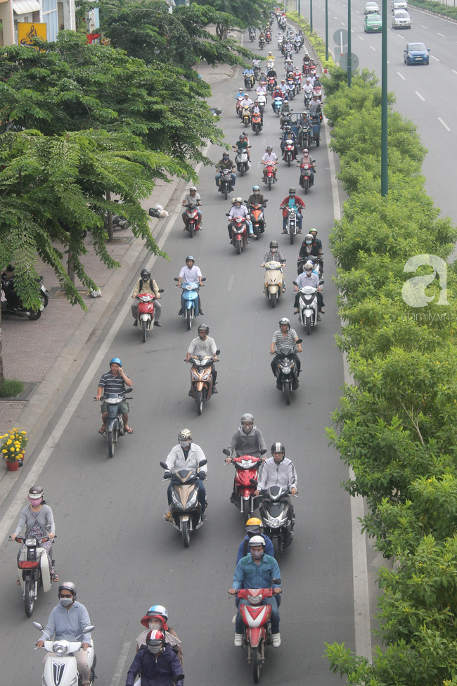Hình ảnh giao thông Hà Nội, Sài Gòn thông thoáng trong buổi sáng ngày đầu tiên đi làm sau Tết - Ảnh 19.