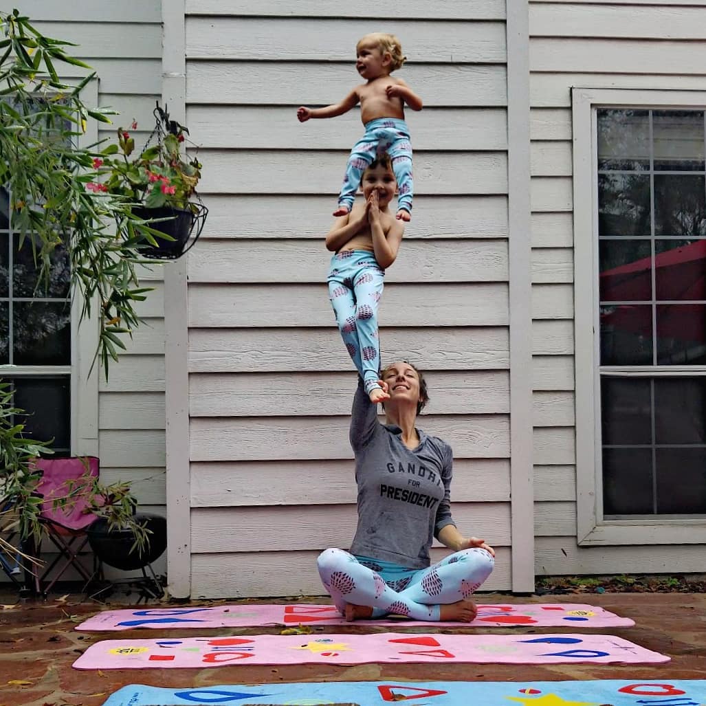 Mom Breastfeeding While Doing Yoga