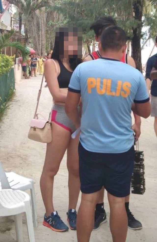 Bị khách sạn nhắc nhở khi mặc bikini dạng dây phản cảm, nữ du khách ngoan cố diện đi khắp bãi biển rồi bị chính quyền xử phạt răn đe - Ảnh 3.