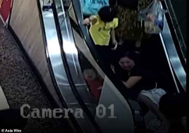 15780896-7225209-Surveillance_video_shows_the_two_year_old_riding_the_escalator_w-a-87_1562602237953 (1)