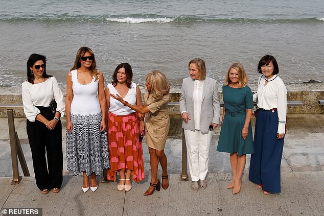 17698150-7394837-Brigitte_Macron_was_seen_chatting_to_the_other_women_as_Melania_-a-9_1566822585033