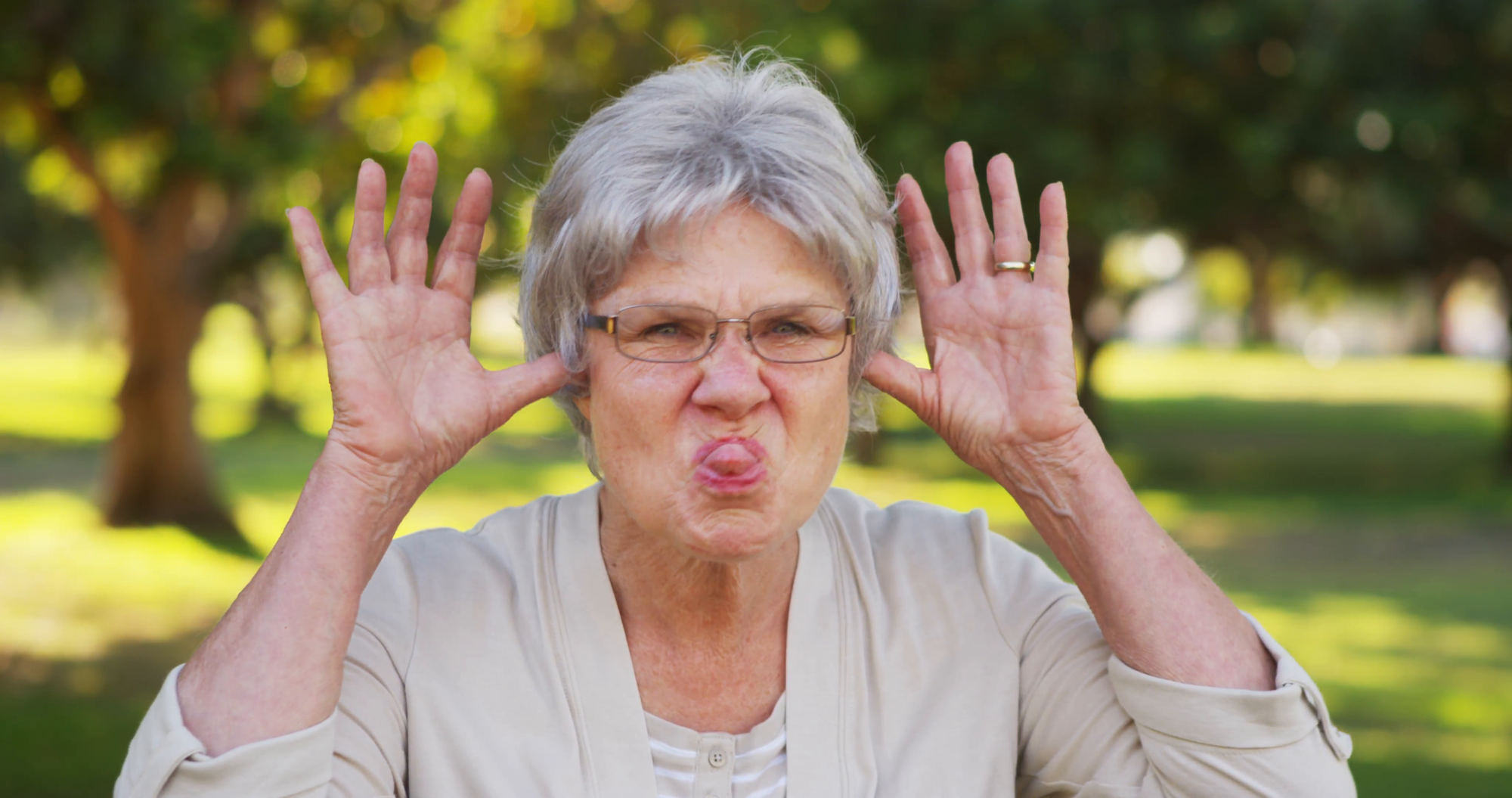silly-grandma-making-funny-faces-at-the-camera_eybj0uifl__F0000