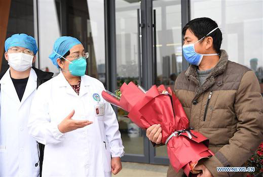 Trung Quốc: Bệnh nhân nhiễm virus corona đầu tiên xuất viện - Ảnh 3.
