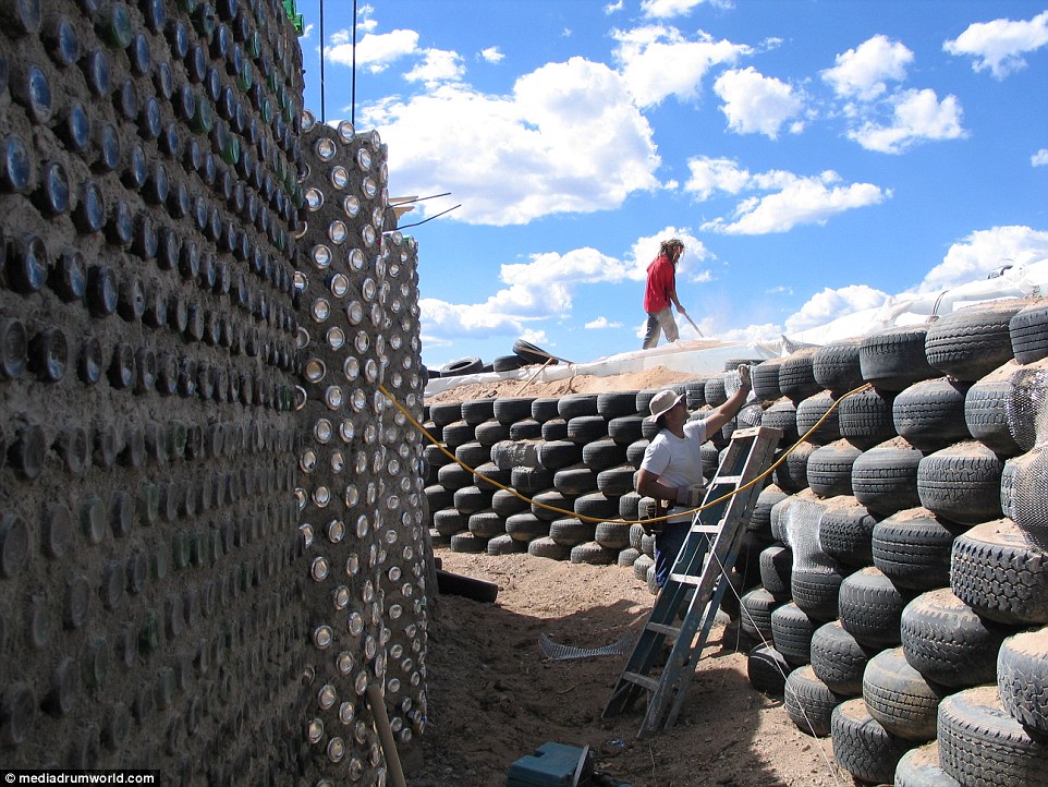 The houses are built using old car and truck tires, pictured, reducing the need to use new materials 