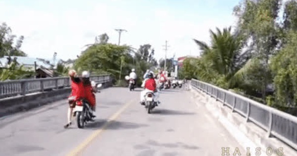 Wearing a skirt and sitting on the side of a motorbike, the woman fell face down on the road