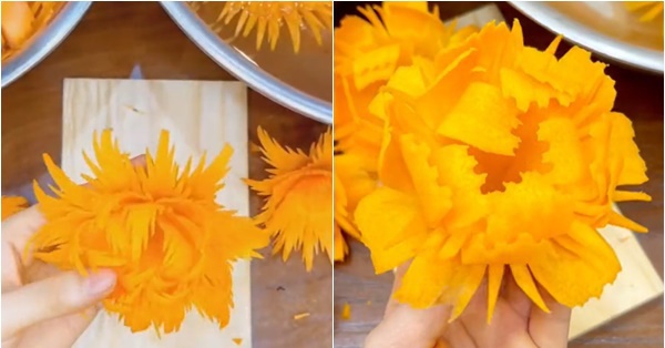The girl was amazed by using an old knife to prune the beautiful carrot flowers