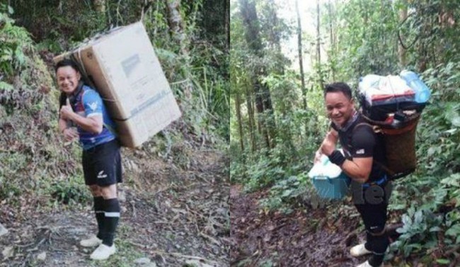 Thầy giáo ở Malaysia vác tủ lạnh 40kg và vượt 10km đường rừng chỉ để thực hiện một mong muốn đáng quý - Ảnh 1.
