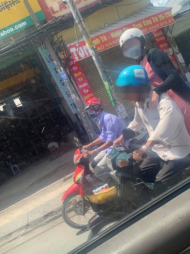 Đi xe máy dưới trời nắng cháy da, người phụ nữ có dáng ngồi khiến tất cả đều ngoái nhìn khó hiểu - Ảnh 3.