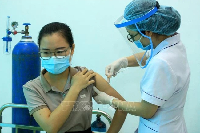 Bộ Y tế hướng dẫn quy trình cấp 'Hộ chiếu vaccine' cho người dân - Ảnh 1.