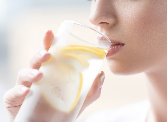 woman-drinking-lemon-water-16526196070551872265072.jpg