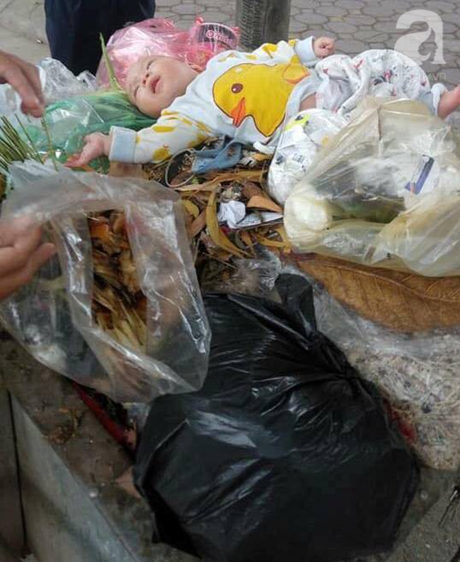 Vụ bé trai bị bỏ trong thùng rác ở Hà Nội: Tôi rùng mình khi thấy chân tay bé giãy giụa - Ảnh 2.