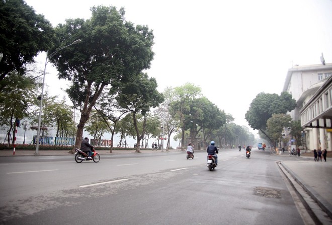 Sáng 29 Tết, nhiều tuyến phố Hà Nội đã vắng bóng người qua lại - Ảnh 14.