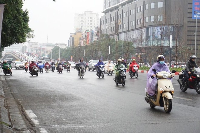 Ngày đi làm đầu tiên năm 2018: Sài Gòn nắng đẹp thông thoáng, Hà Nội mưa phùn ùn ứ nhẹ - Ảnh 21.