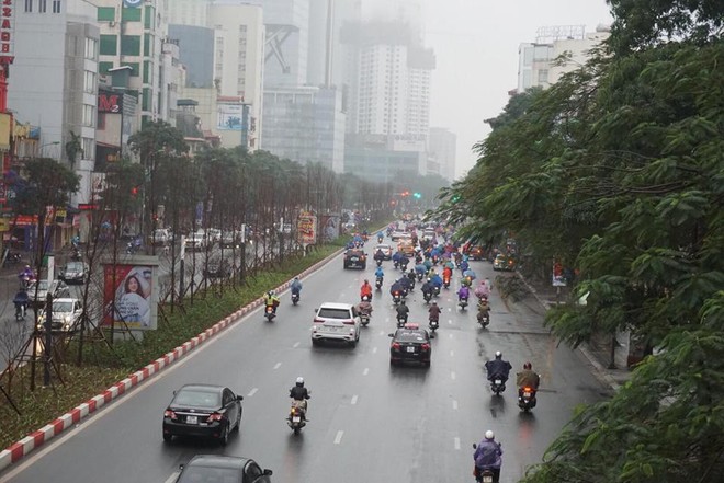 Ngày đi làm đầu tiên năm 2018: Sài Gòn nắng đẹp thông thoáng, Hà Nội mưa phùn ùn ứ nhẹ - Ảnh 22.