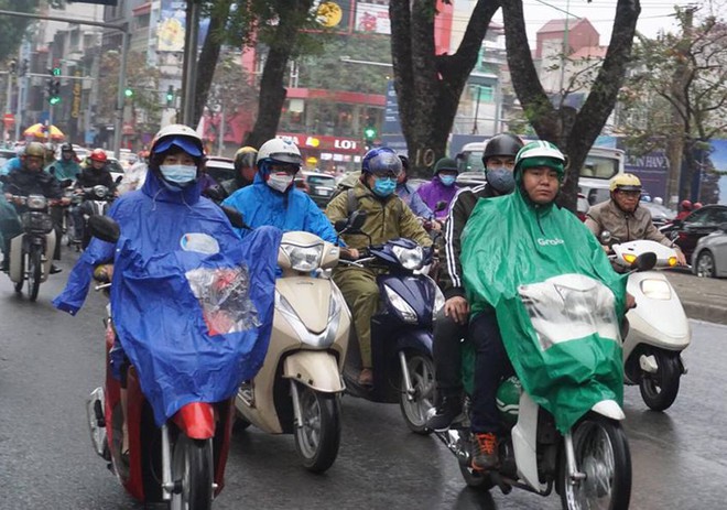 Ngày đi làm đầu tiên năm 2018: Sài Gòn nắng đẹp thông thoáng, Hà Nội mưa phùn ùn ứ nhẹ - Ảnh 19.
