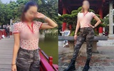 Người phụ nữ "thả rông" đi khắp Sài Gòn cùng chồng con lại tiếp tục mặc áo xuyên thấu khoe ngực trần tạo kiểu khó hiểu trước Đền Ngọc Sơn