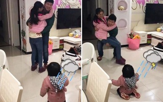 Thấy bố sắp đi công tác bịn rịn ôm mẹ, phản ứng của cô con gái khiến ai nấy phá lên cười