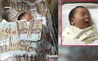 Đứa trẻ sơ sinh ngủ giữa đống tiền và nguyên do khiến nhiều người không khỏi ngao ngán