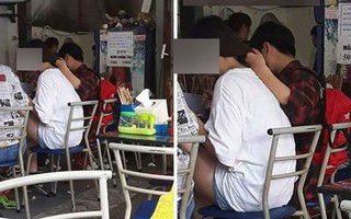 Chàng trai một tay cầm đũa một tay giữ tóc để người yêu ăn phở cho đỡ nóng, dân tình tranh cãi xôn xao