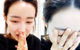 Nữ thần tượng Kpop bật khóc, chắp tay cầu xin sau khi để lộ số điện thoại thành viên chung nhóm trên livestream